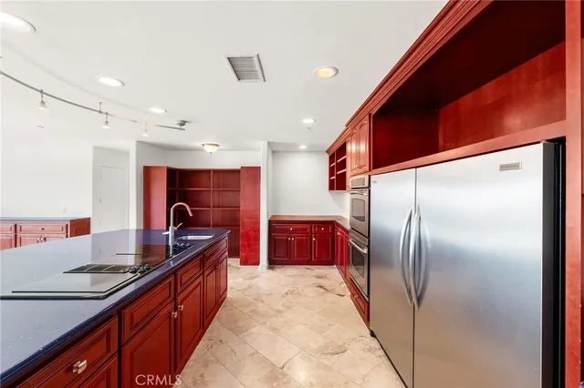 an empty room with windows and entrance