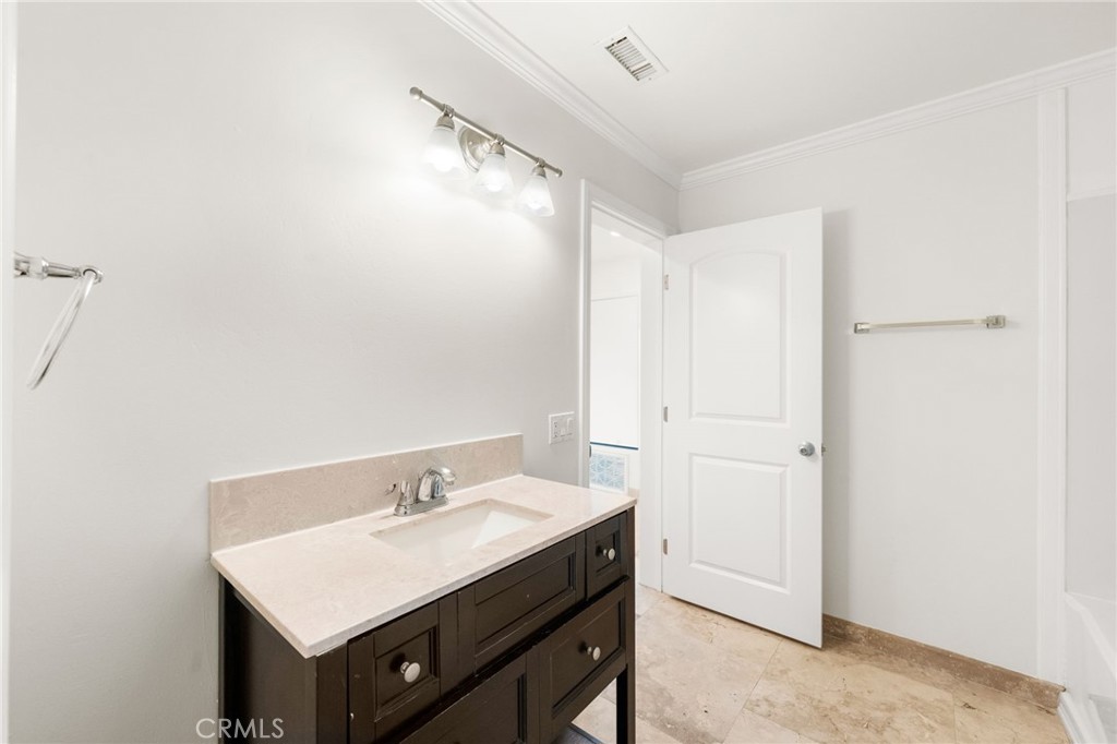 31460 Aquaduct Road Bonsall, CA 92003 - Photo 22 of 57 a bathroom with a sink vanity and a mirror