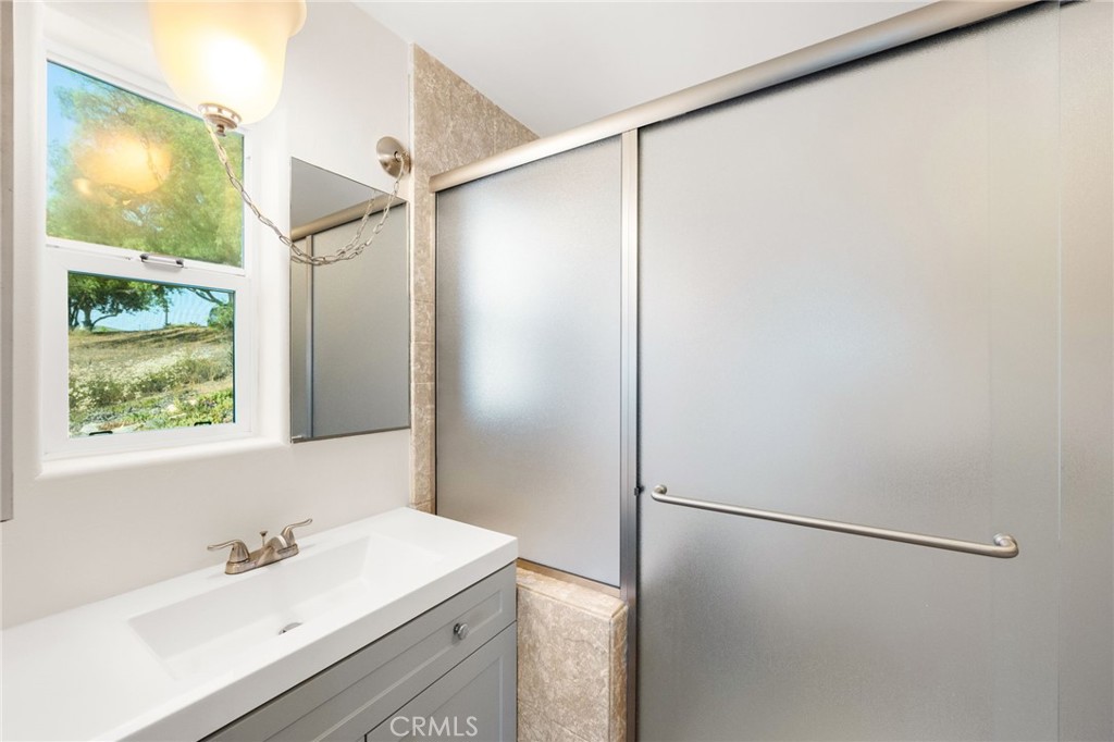 31460 Aquaduct Road Bonsall, CA 92003 - Photo 24 of 57 a bathroom with a sink and a shower