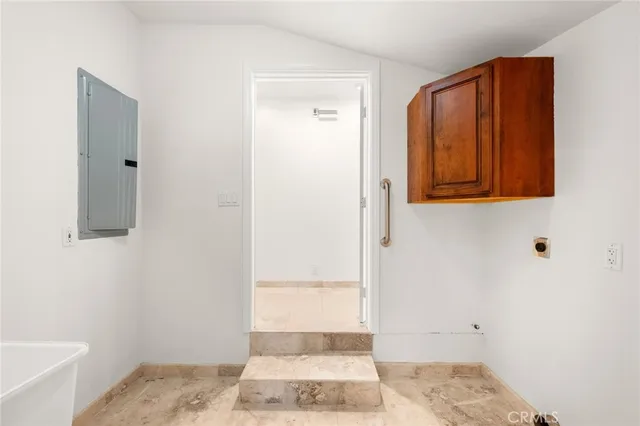 a bathroom with a granite countertop sink a mirror and bathtub