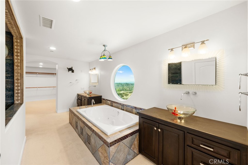 31460 Aquaduct Road Bonsall, CA 92003 - Photo 31 of 57 a bathroom with a sink and a mirror