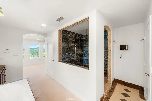 a bathroom with a granite countertop toilet a sink and mirror