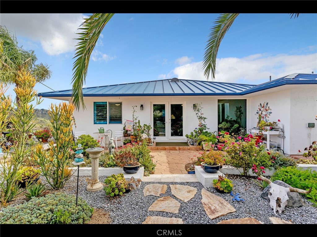 31460 Aquaduct Road Bonsall, CA 92003 - Photo 36 of 57 a view of a house with backyard sitting area and porch