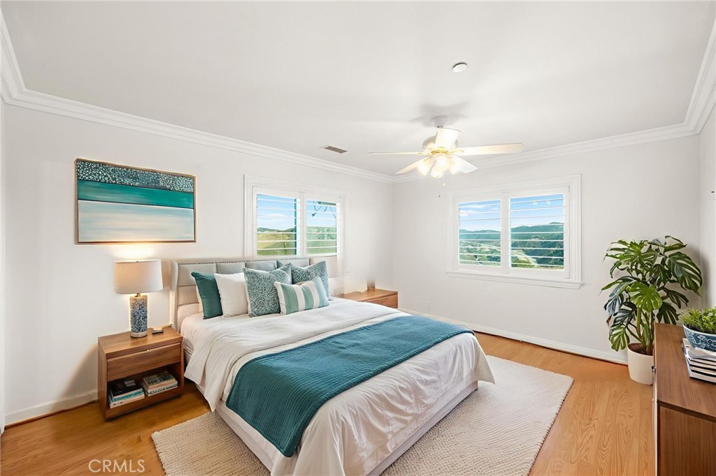 31460 Aquaduct Road Bonsall, CA 92003 - Photo 40 of 57 a bedroom with a bed and a chandelier