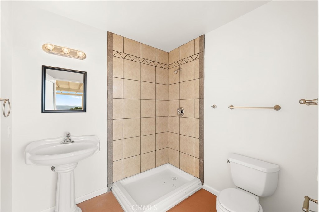 31460 Aquaduct Road Bonsall, CA 92003 - Photo 47 of 57 a bathroom with a shower toilet and sink