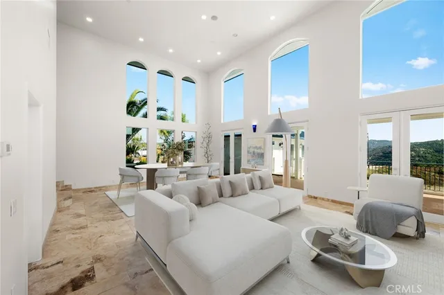 a dining room with furniture a potted plant and a fireplace