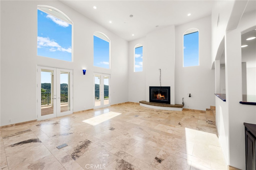 31460 Aquaduct Road Bonsall, CA 92003 - Photo 9 of 57 a view of a livingroom with wooden floor and a fireplace