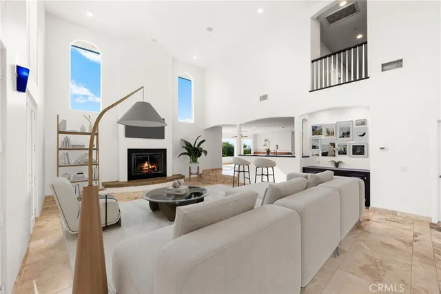 a large kitchen with stainless steel appliances a large counter top oven and cabinets