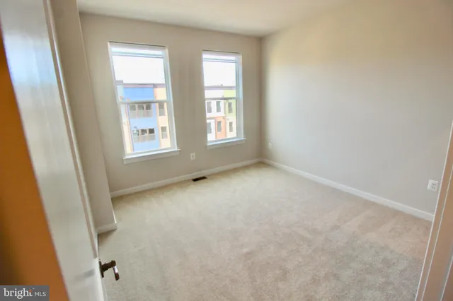 an empty room with windows