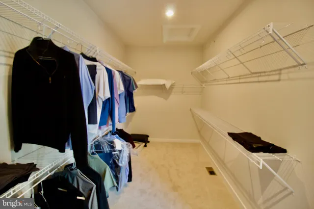 a bathroom with a sink mirror and toilet