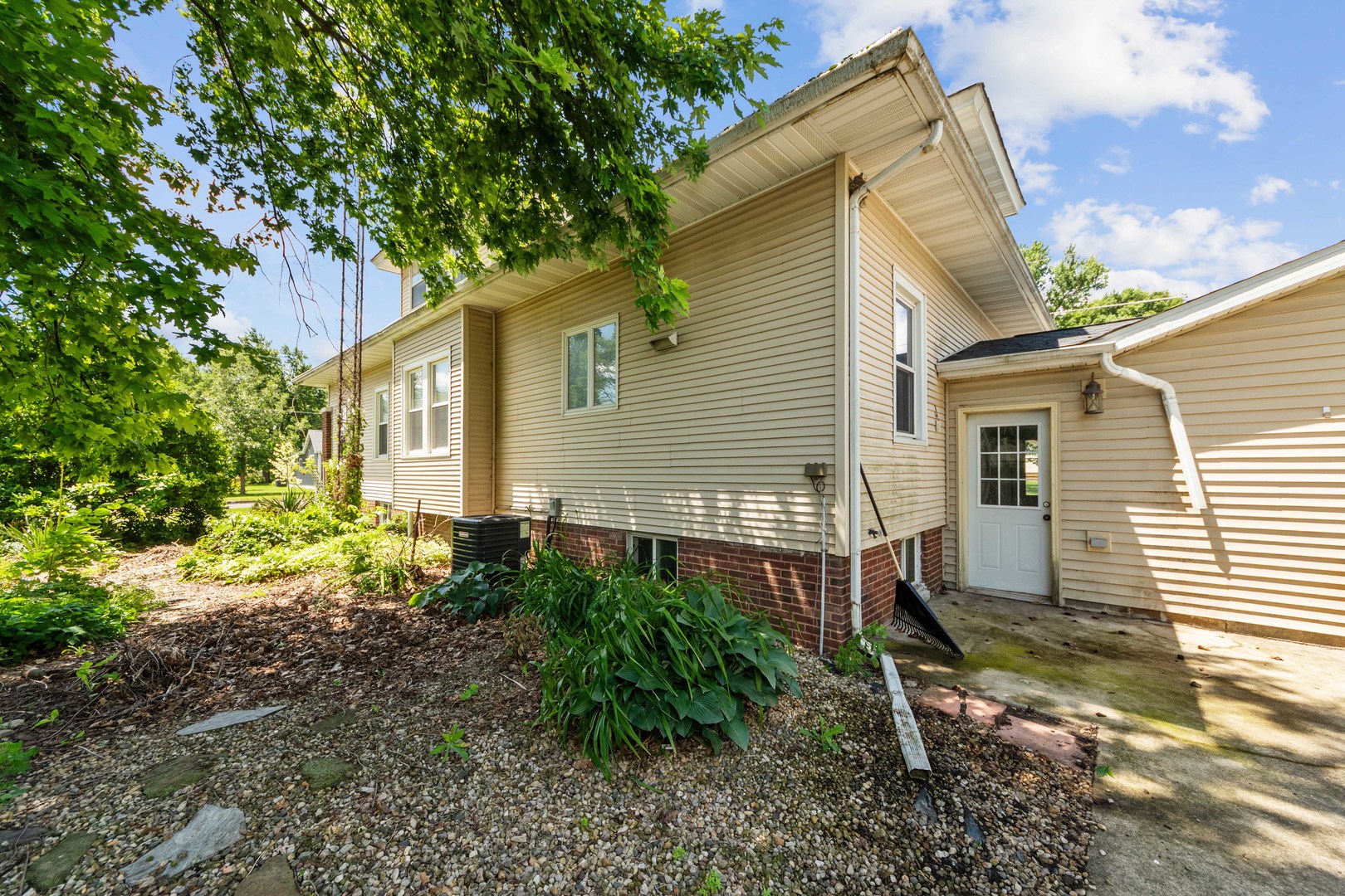 412 West 5th Street Minonk, IL 61760 - Photo 20 of 23 a view of a house with backyard and a tree
