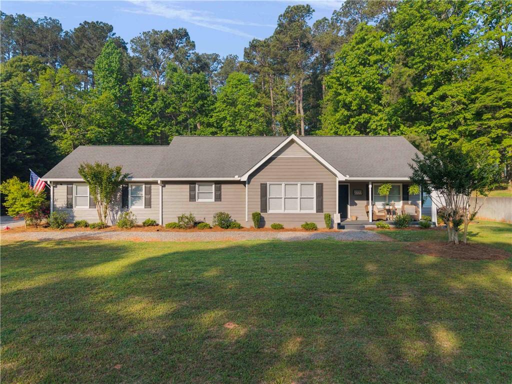 2777 Chickadee Drive Monroe, GA 30655 - Photo 1 of 36 a front view of a house with a garden