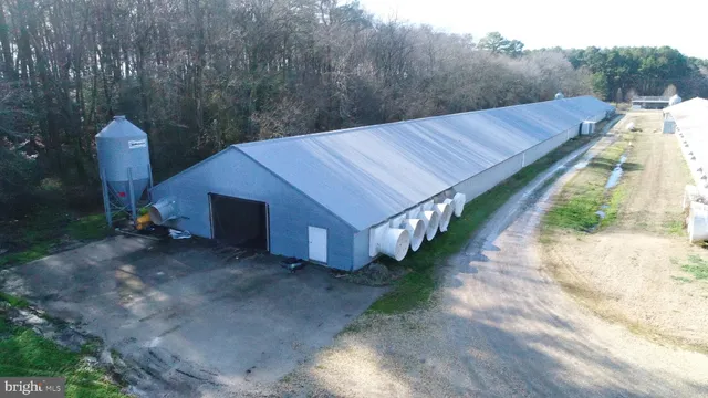 a view of a small house in the middle of a yard