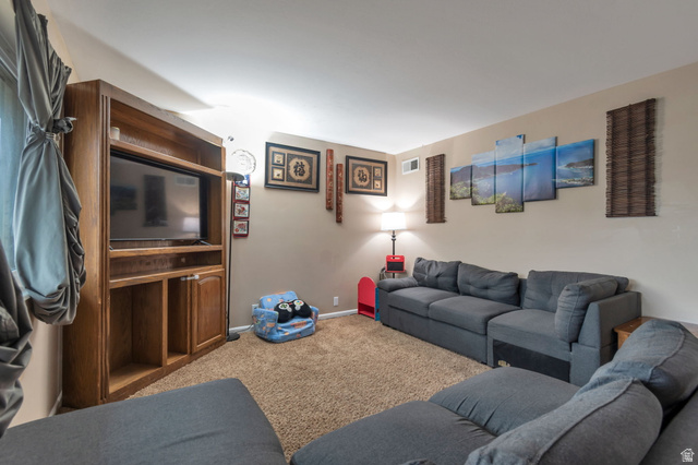 7466 Washington Road Magna, UT 84044 - Photo 4 of 21 Built-in media center with wood-finish cabinetry