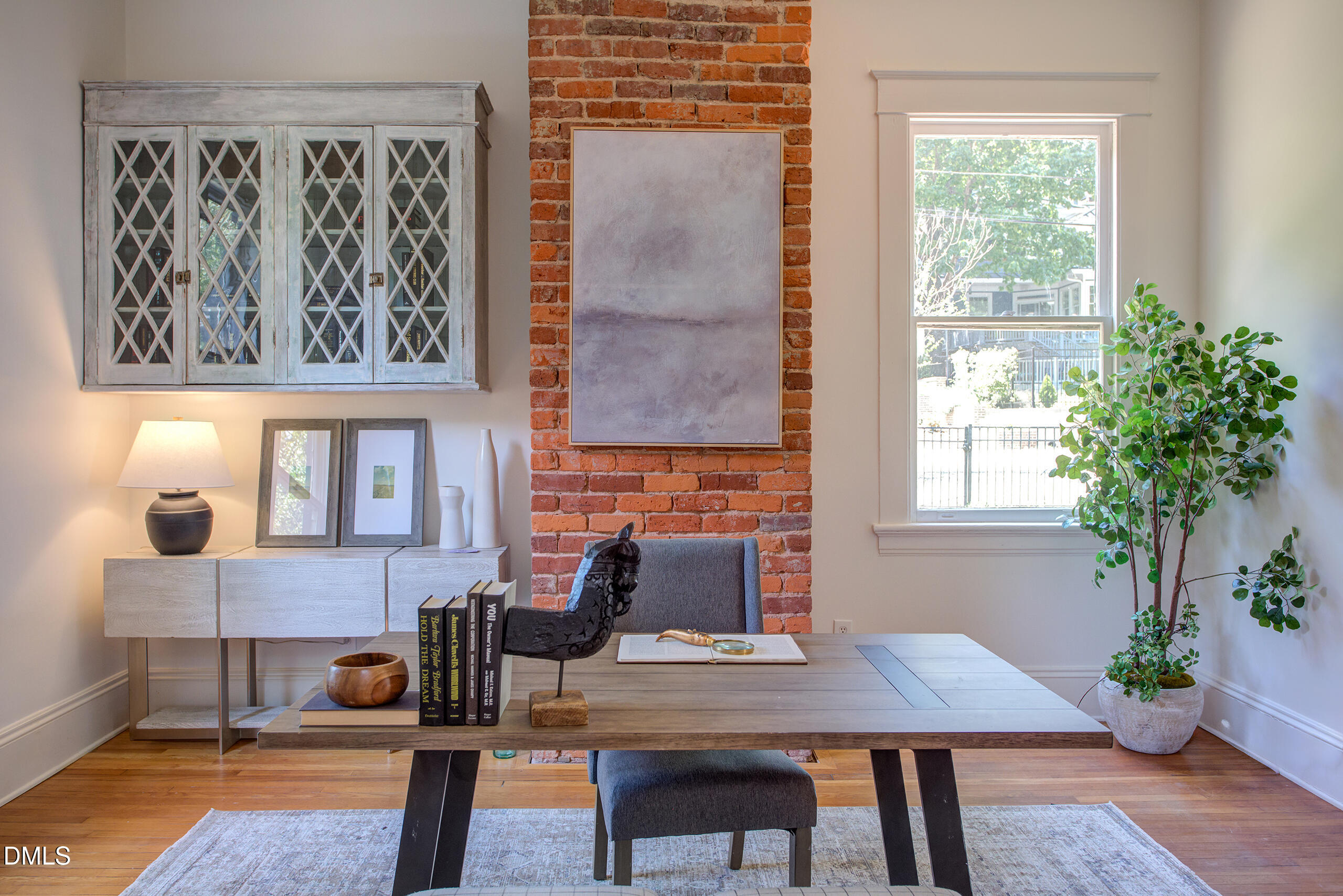 127 Forest Road Raleigh, NC 27605 - Photo 34 of 75 a workspace with furniture and a potted plant