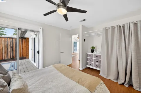 a bedroom with a bed dresser and a window