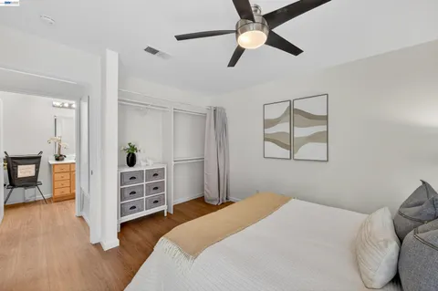 a bedroom with furniture and a chandelier