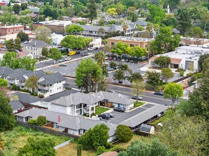 an aerial view of a house with yard swimming pool and outdoor seating