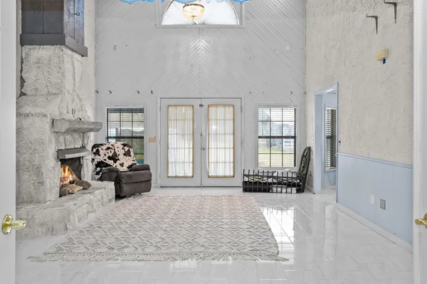 a view of a livingroom with furniture and a window