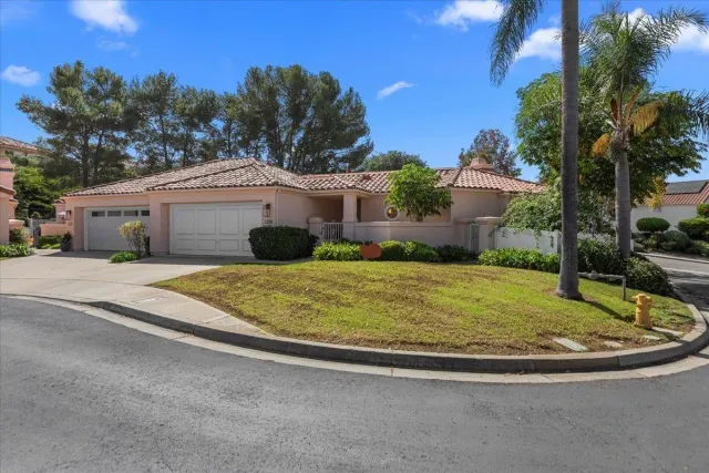 a house view with a garden space