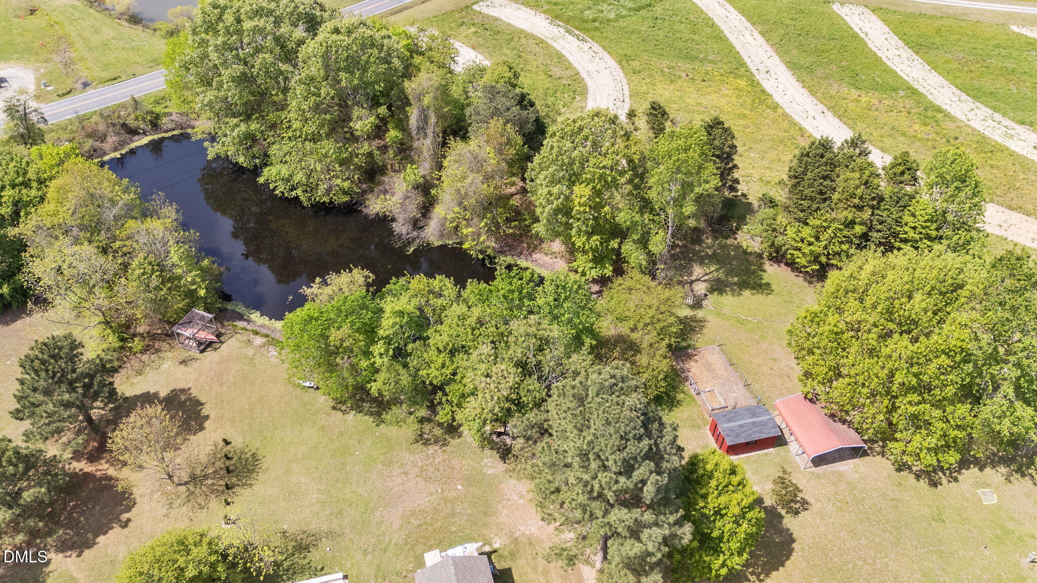 709 Slippery Bank Court Benson, NC 27504 - Photo 12 of 43 a view of a lake with a yard