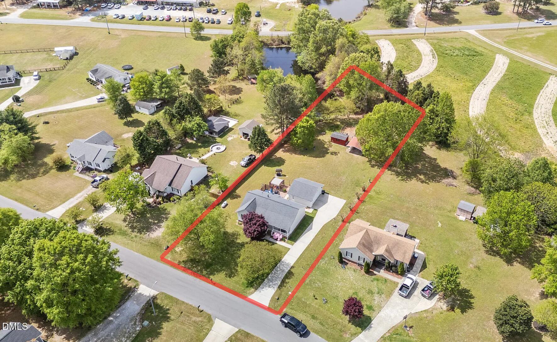 709 Slippery Bank Court Benson, NC 27504 - Photo 14 of 43 an aerial view of residential houses with outdoor space