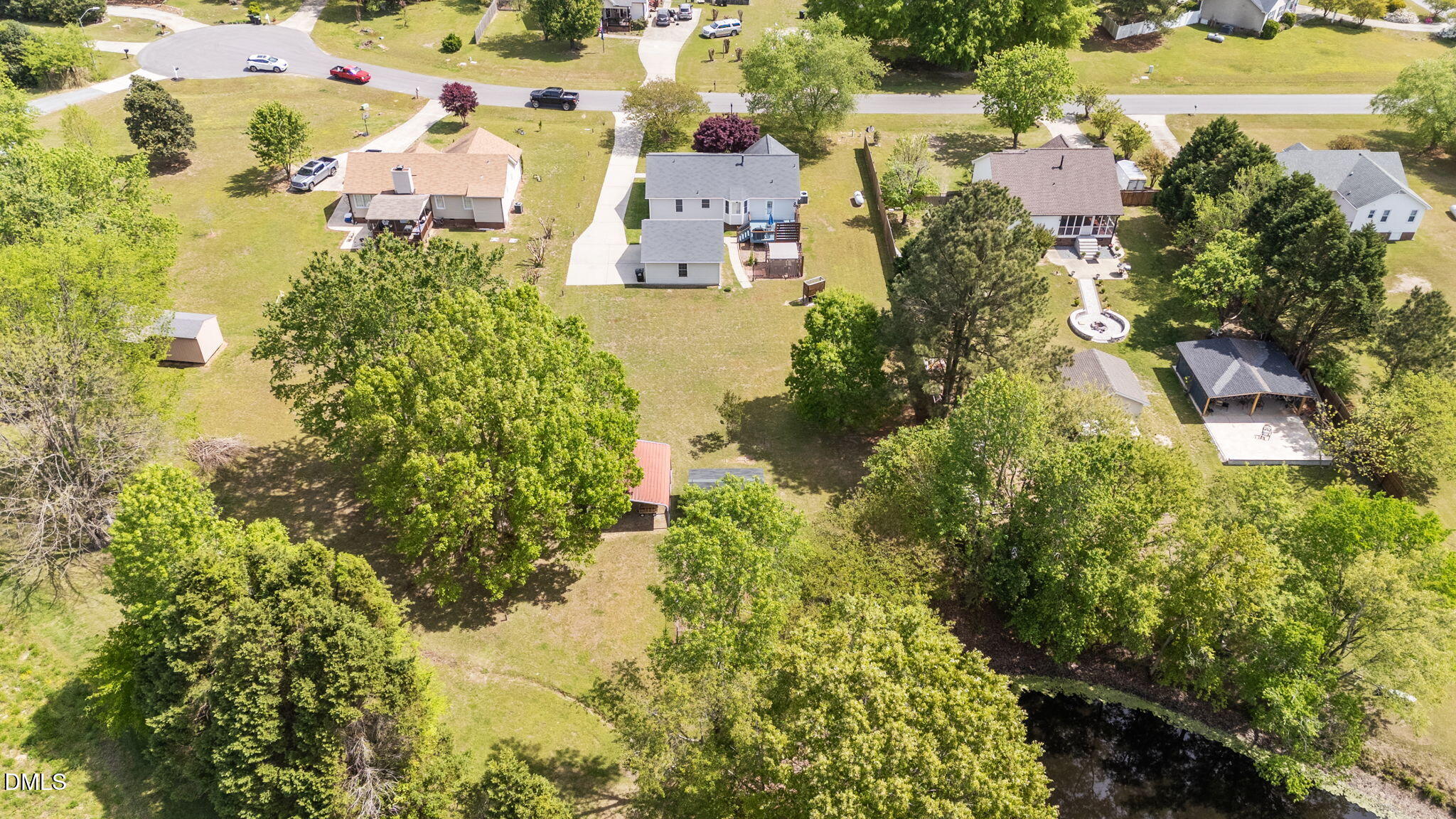 709 Slippery Bank Court Benson, NC 27504 - Photo 15 of 43 an aerial view of residential house with outdoor space and trees all around