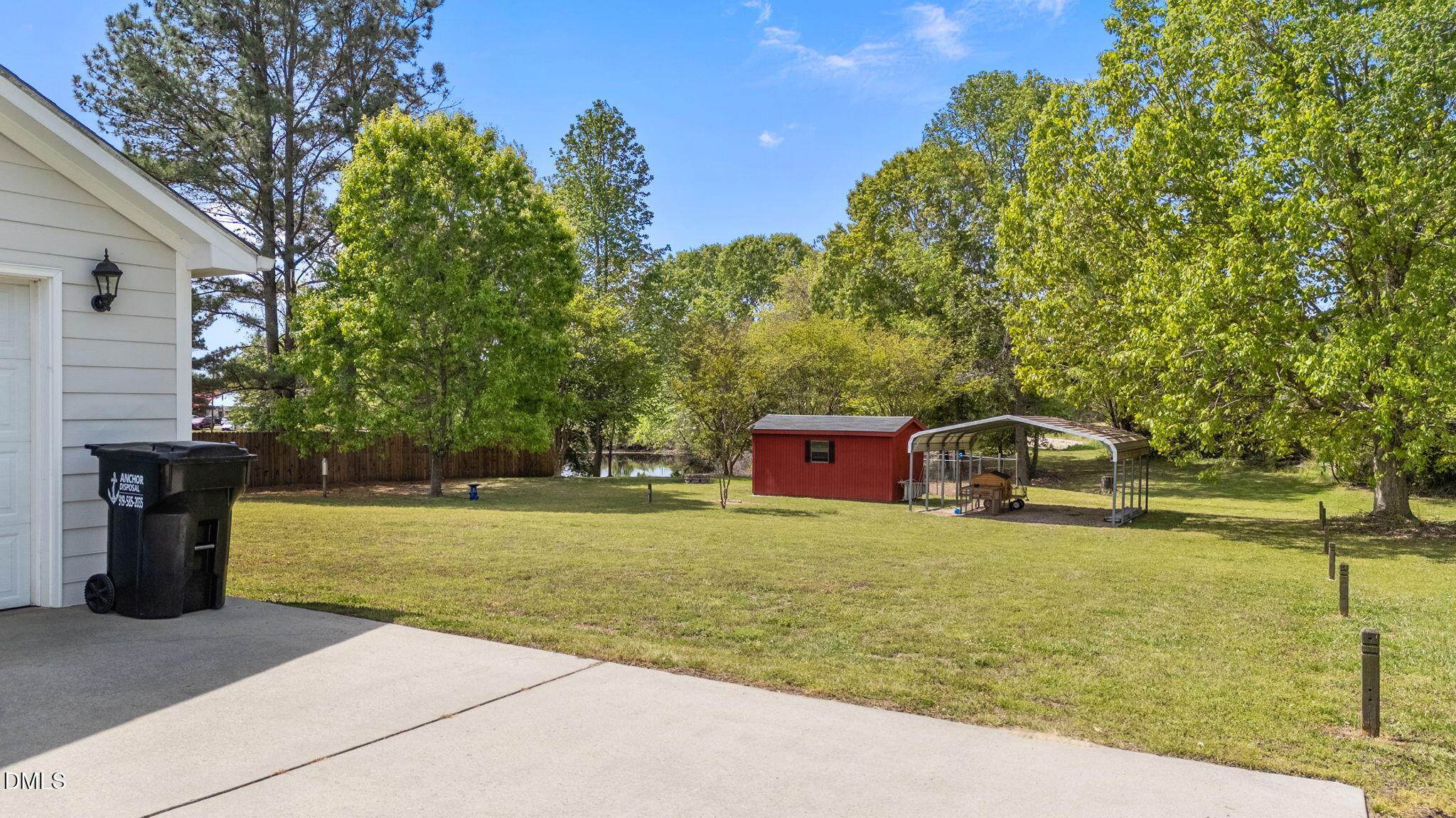 709 Slippery Bank Court Benson, NC 27504 - Photo 18 of 43 a front view of a house with garden