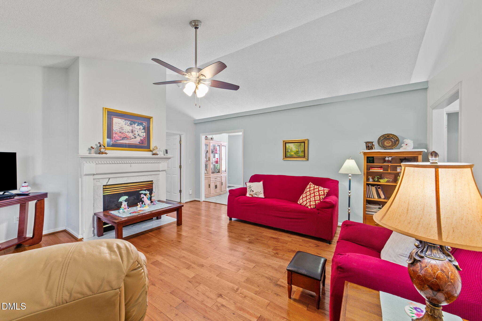 709 Slippery Bank Court Benson, NC 27504 - Photo 19 of 43 a living room with furniture and a fireplace