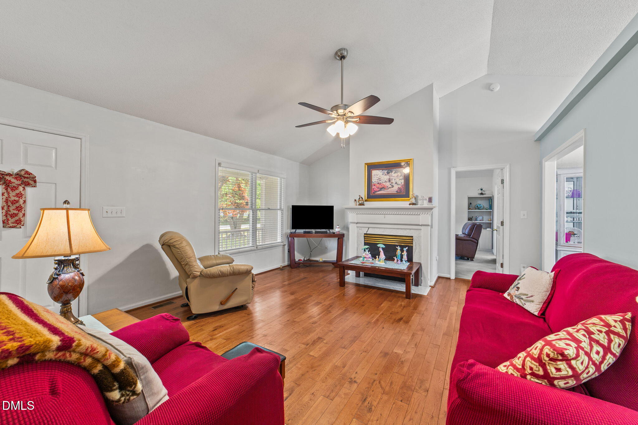 709 Slippery Bank Court Benson, NC 27504 - Photo 20 of 43 a living room with furniture and a fireplace