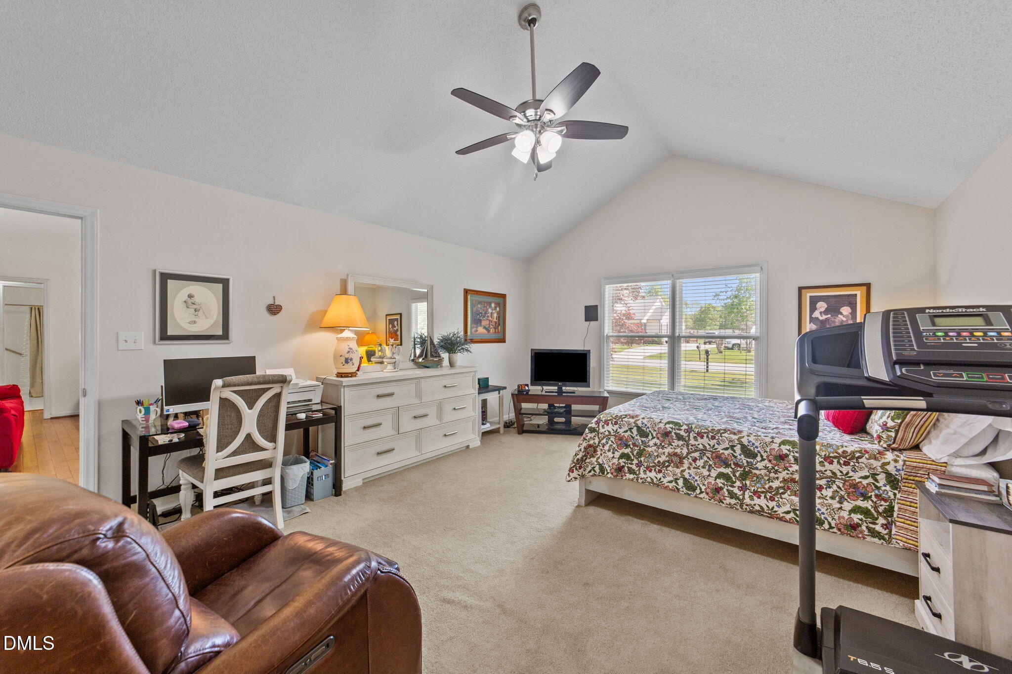 709 Slippery Bank Court Benson, NC 27504 - Photo 33 of 43 a bed room with furniture and a flat screen tv