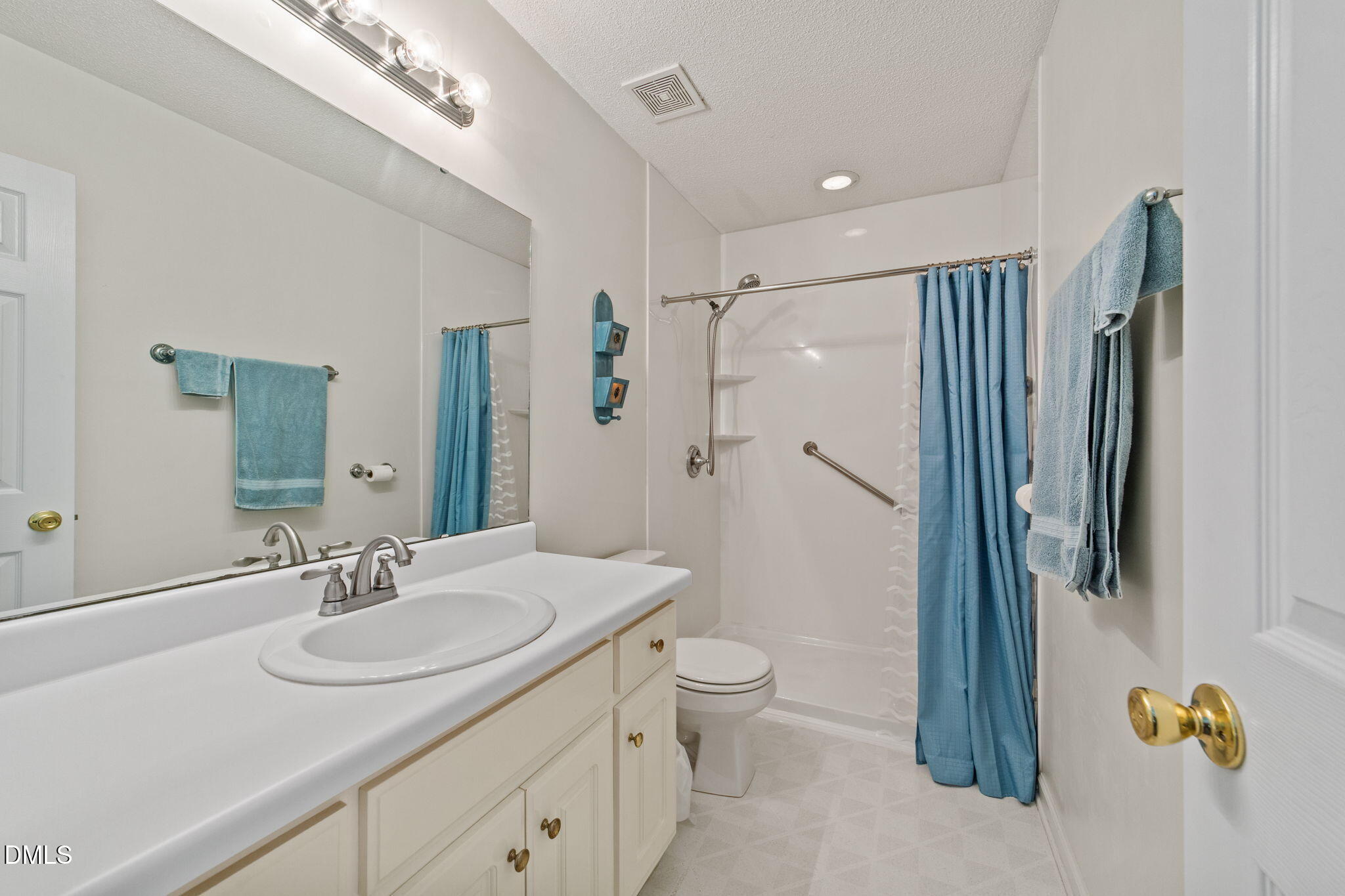 709 Slippery Bank Court Benson, NC 27504 - Photo 35 of 43 a bathroom with a granite countertop sink toilet and shower