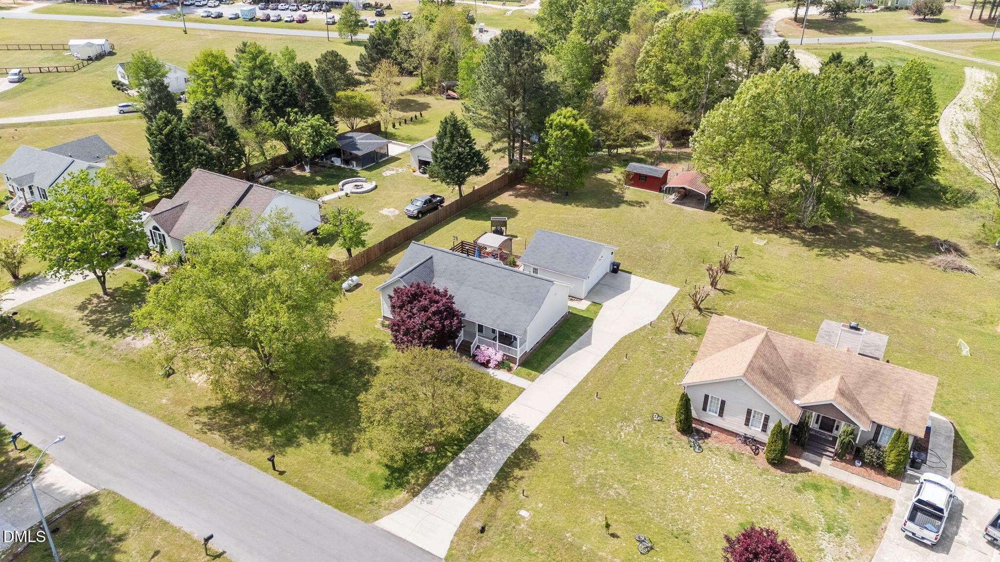 709 Slippery Bank Court Benson, NC 27504 - Photo 5 of 43 an aerial view of a house with a yard basket ball court and outdoor seating