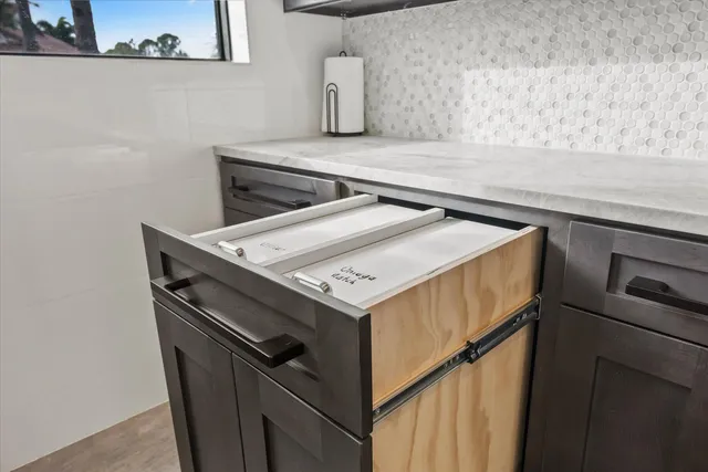 an aerial view of house with yard swimming pool and outdoor seating