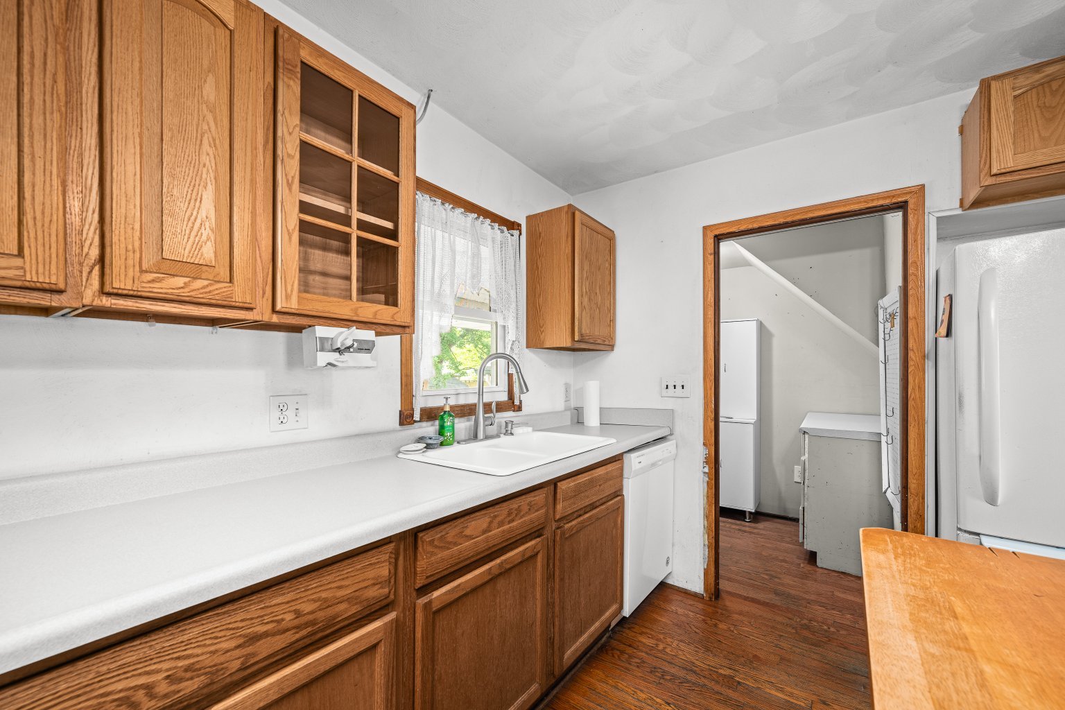 200 West Locust Street Cambridge, IL 61238 - Photo 14 of 32 a kitchen with a sink cabinets and wooden floor