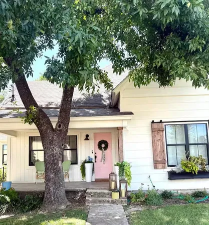 a front view of a house with garden
