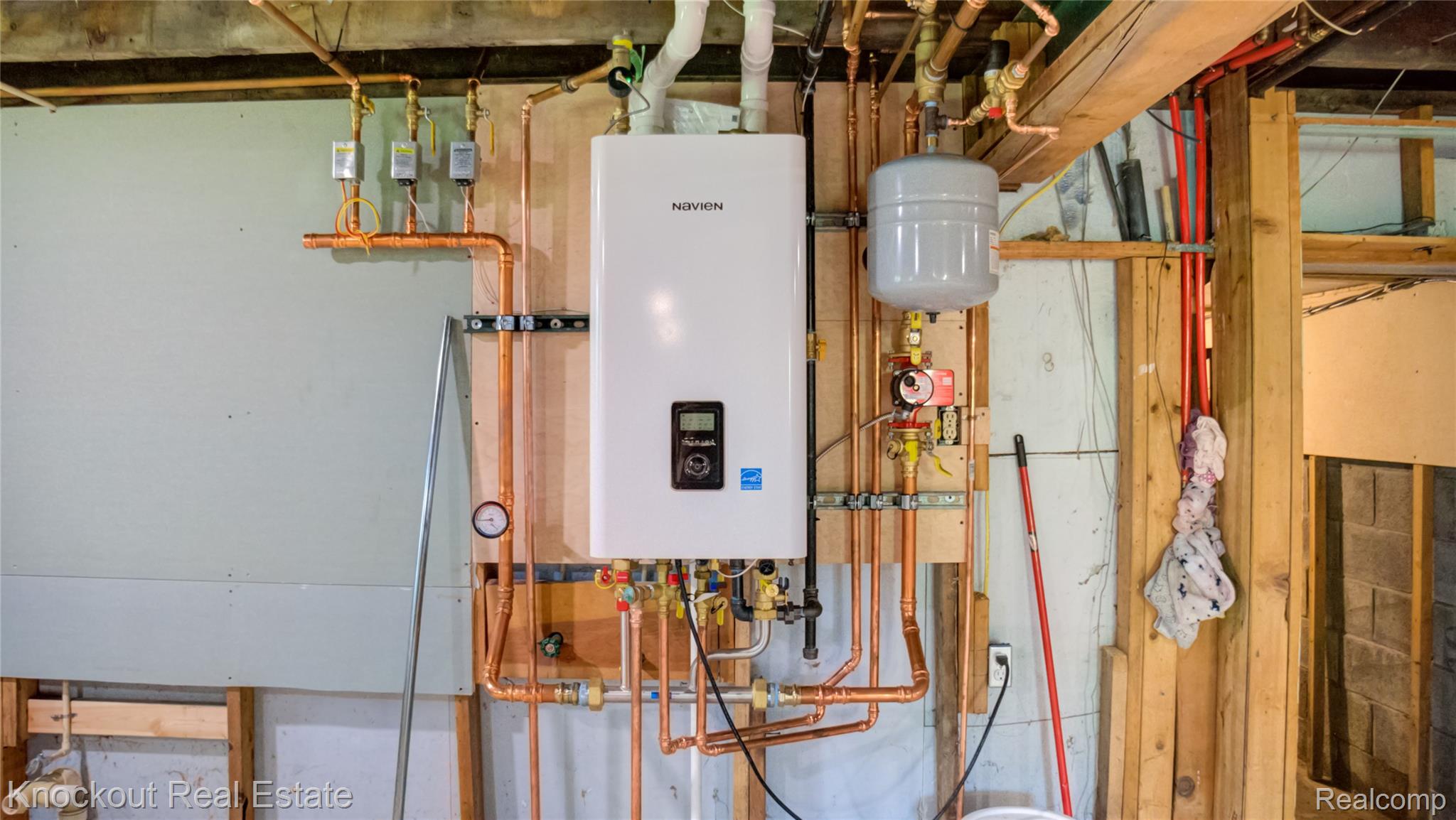 4195 Williamson Road Saginaw, MI 48601 - Photo 34 of 50 Tankless water heater installation with copper piping and an expansion tank