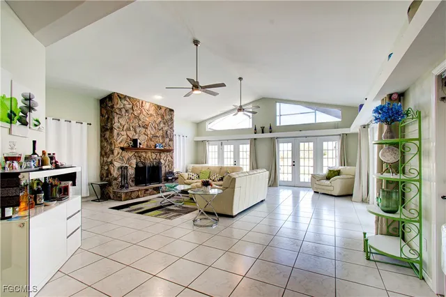a living room with furniture large window and flat screen tv