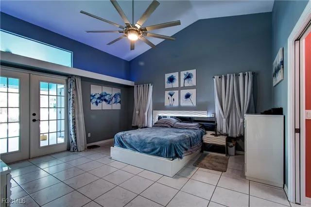 a living room with a couch and a chandelier