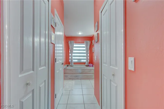 a view of entryway with a bathtub