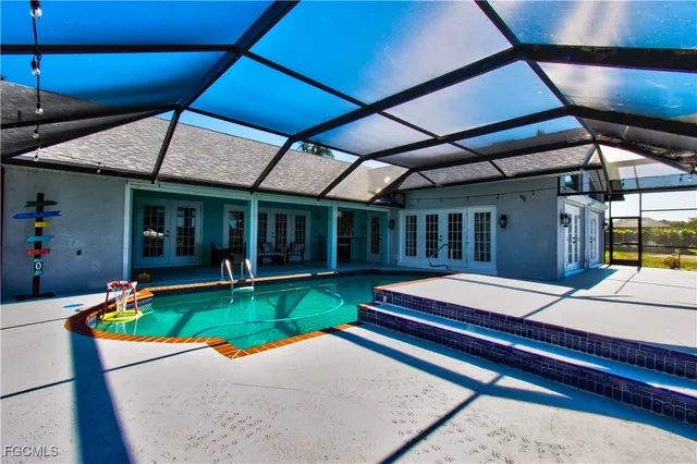 a view of a swimming pool with a patio