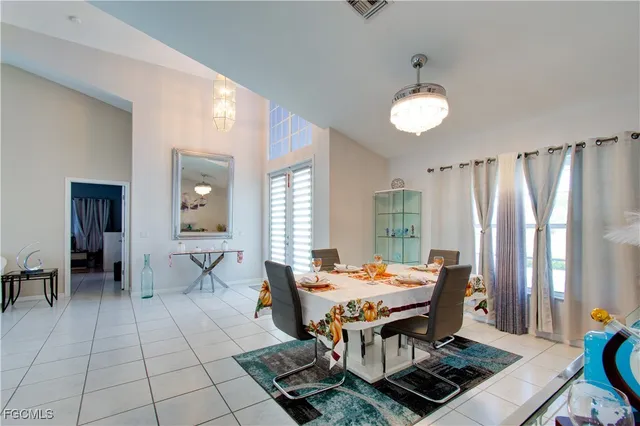 a view of a dining room with furniture and window