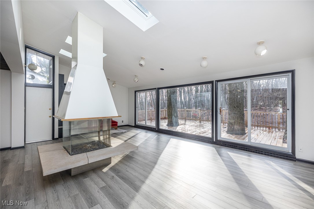 5700 Brookside Road Independence, OH 44131 - Photo 4 of 42 Great room with newer LVT flooring and stunning views of the backyard.