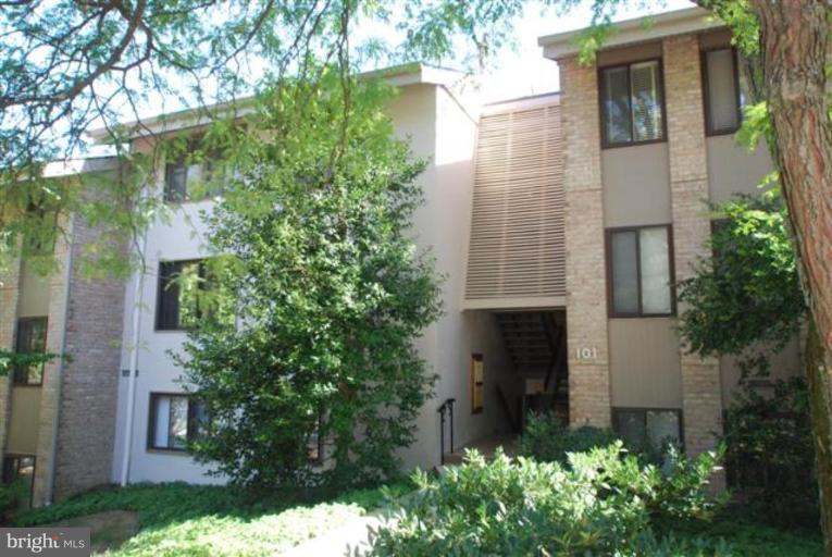 101 Cross Keys Road, Unit B Baltimore, MD 21210 - Photo 1 of 12 front view of a house with a yard and an trees