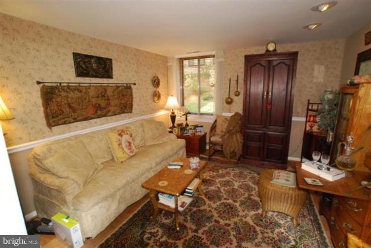 101 Cross Keys Road, Unit B Baltimore, MD 21210 - Photo 12 of 12 a living room with furniture and a flat screen tv