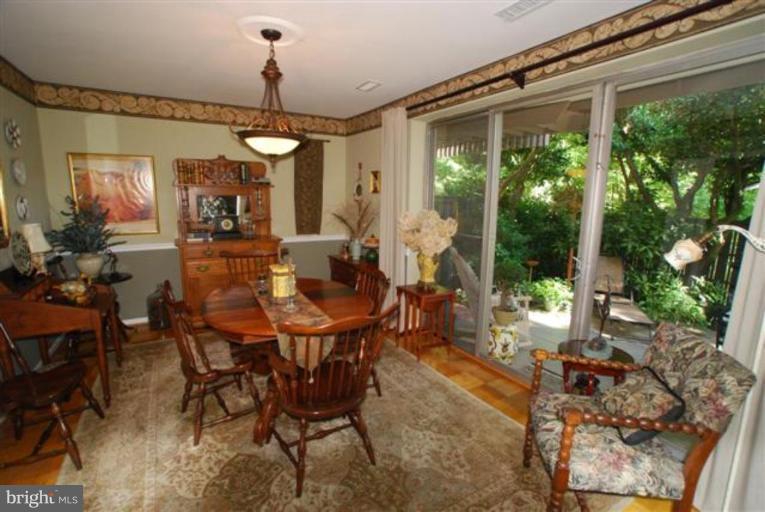 101 Cross Keys Road, Unit B Baltimore, MD 21210 - Photo 5 of 12 a view of a dining room with furniture window and outside view