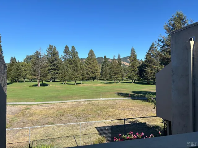 a view of a golf course with a lake