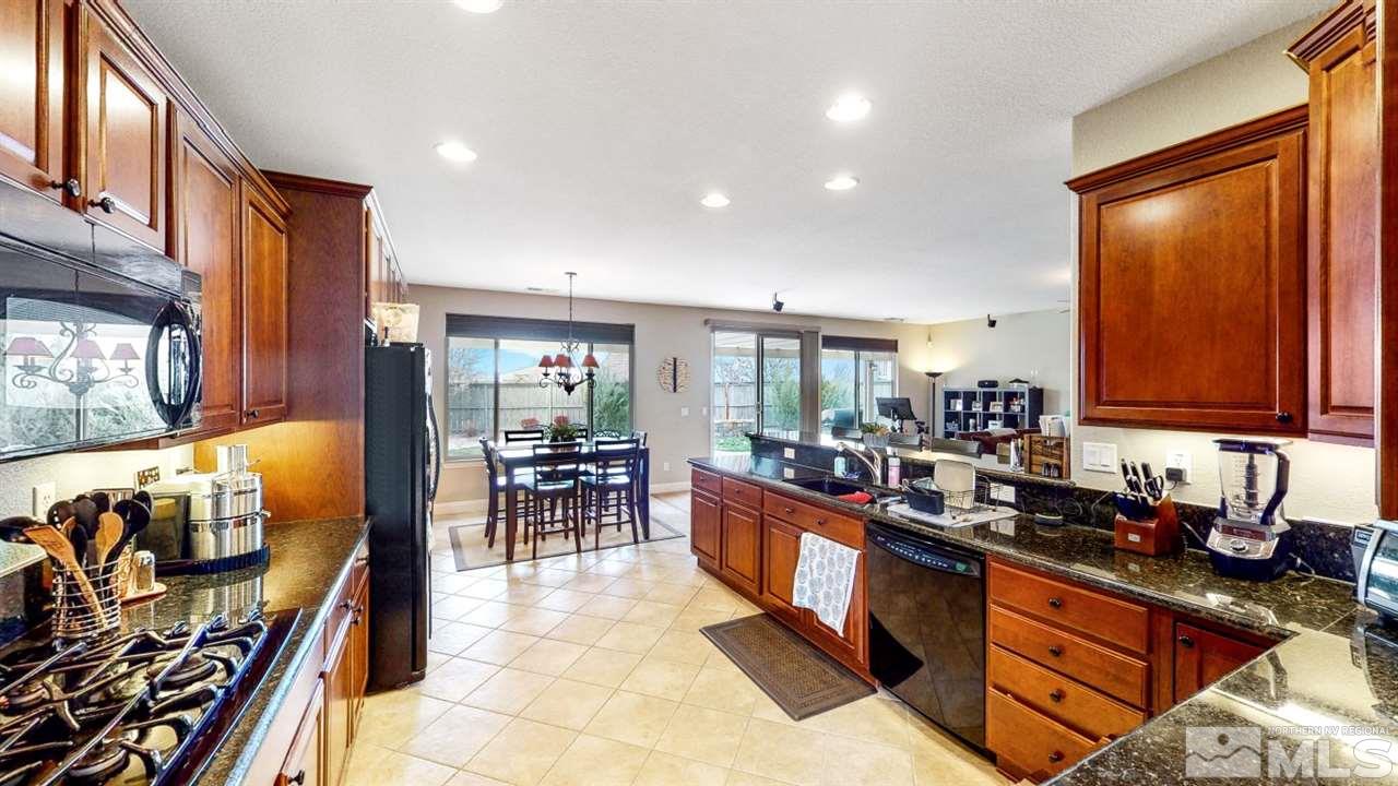 14095 Winners Cup Drive Reno, NV 89521 - Photo 1 of 23 a large kitchen with lots of counter top space