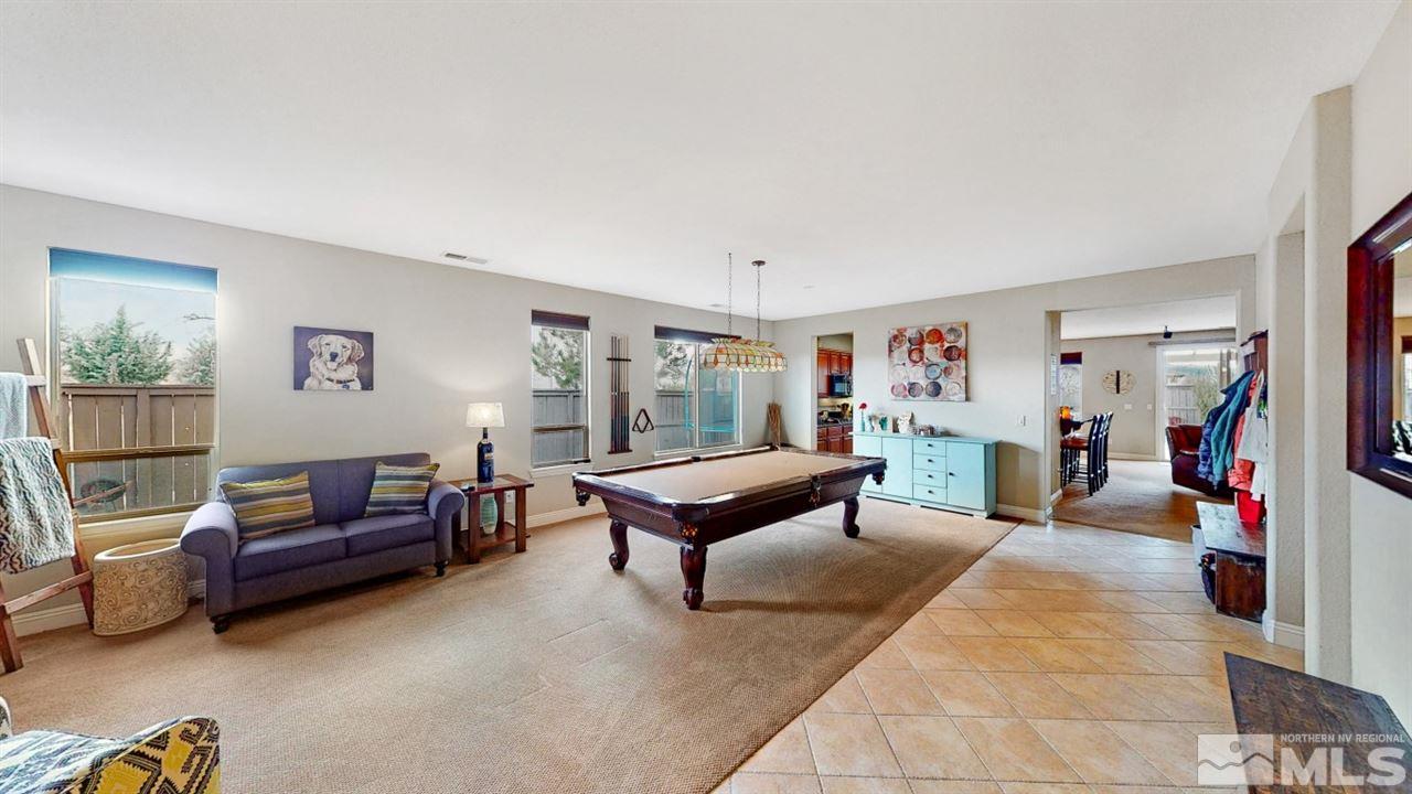 14095 Winners Cup Drive Reno, NV 89521 - Photo 2 of 23 a living room with furniture and a flat screen tv