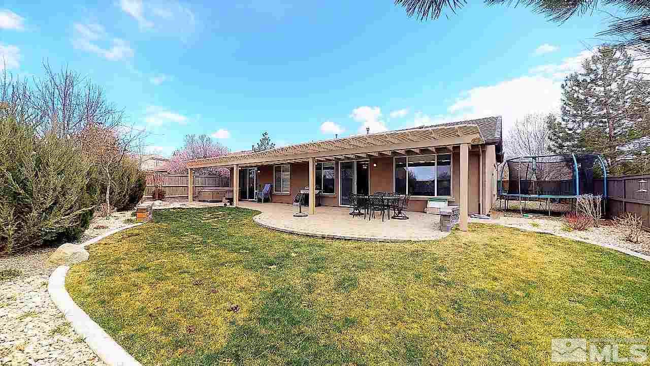 14095 Winners Cup Drive Reno, NV 89521 - Photo 22 of 23 a view of a house with swimming pool and porch with furniture